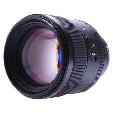 Sony FE 85mm F1.4 GM angled front view showing G badge and AF/MF switch