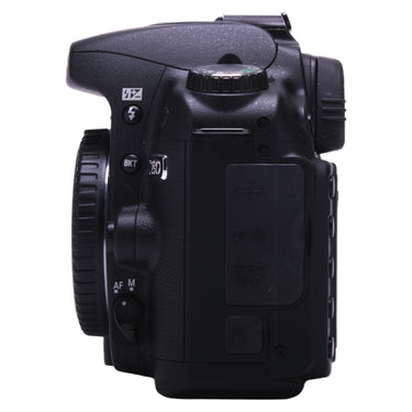 Nikon D80 left side showing lens release, AF/M switch, and port covers