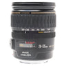 Canon EF 28-135mm IS USM zoom lens standing upright with front cap on, showing zoom scale and Image Stabilizer markings