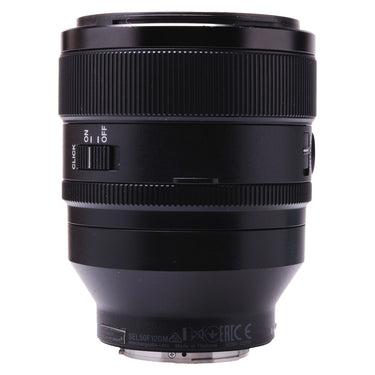 Sony FE 50mm f1.2 GM side view showing click on/off switch and serial label