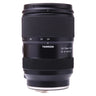 Tamron 28-75mm f2.8 Di III VXD G2 standing upright with front cap on, showing zoom ring and focus scale