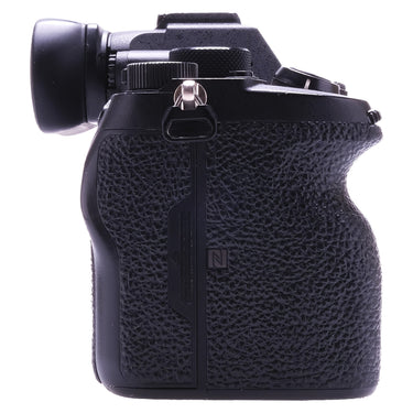Sony a7R IV left side showing textured grip and NFC mark