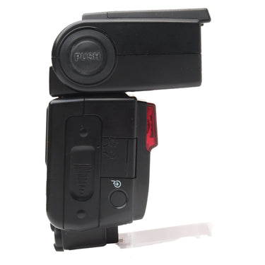 Nikon Speedlight SB-600 side view with PUSH bounce release and battery door
