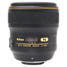 Nikon AF-S 35mm f1.4G prime lens standing upright, front nameplate and focus scale