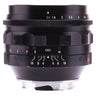 Voigtlander Nokton 50mm f1.1 side view showing aperture and depth of field scales with hood mounted