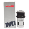 Minox MD 6x16 monocular with lanyard wrapped around body, shown beside its original Minox box