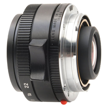 Leica 28mm f2.8 Elmarit-M Asph side view showing chrome mount and rear element