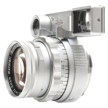Leica Summicron Dual Range front three-quarter view with goggles and front element