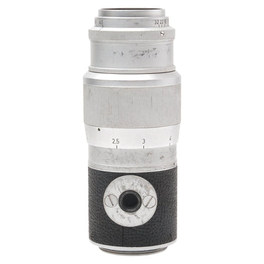 Leica Hektor 13.5cm f4.5 lens side showing depth of field scale and scratches on the barrel