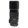 Minolta 300mm f4.5 MC Tele Rokkor-X lens side view with hood extended and focus scale