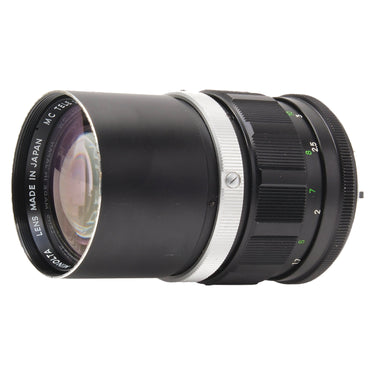 Minolta MC Tele Rokkor-PF angled side view showing front element and barrel