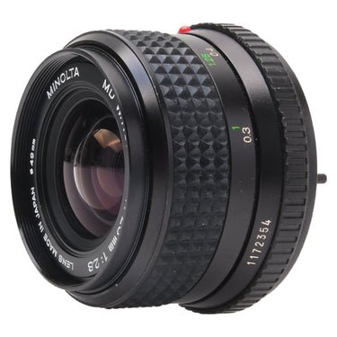 Minolta MD 28mm f2.8 W.Rokkor-X front three-quarter view showing engraved serial 1172354