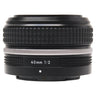 Nikon Z 40mm f2 SE lens side view showing 40mm 1:2 marking and silver ring