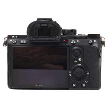 Sony a7 III rear view showing LCD screen, viewfinder, and controls