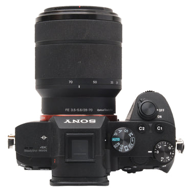 Sony a7 III top plate with mode dial and 28-70mm lens at 70mm