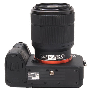 Sony a7 III baseplate showing battery door, tripod socket, and serial number with lens mount label