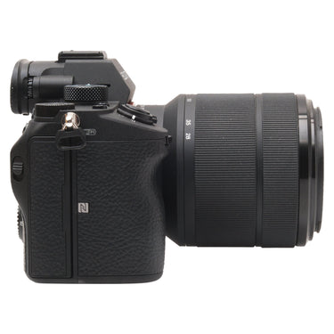 Sony a7 III left side with lens and NFC and Wi-Fi markings