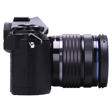 OM System OM-5 with 12-45mm f4 PRO lens, grip side view