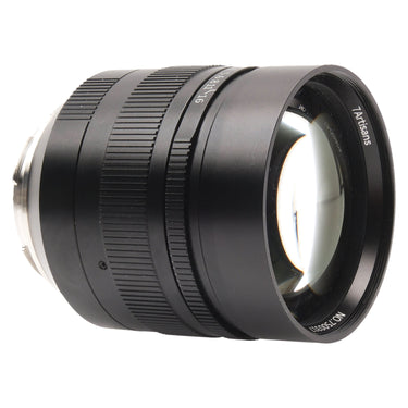 7Artisans 75mm f1.25 II angled view showing barrel, focus scale, and front element