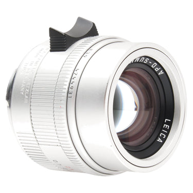 Leica APO-Summicron-M 50mm silver lens side view showing serial number and focus tab