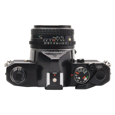 Pentax MX top plate with shutter speed dial, hot shoe, and mounted 50mm lens