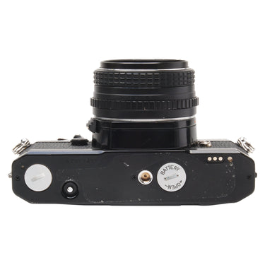 Pentax MX bottom plate showing serial number and battery compartment
