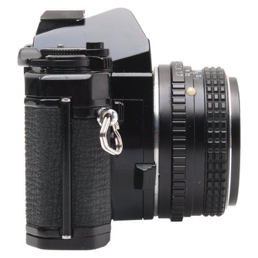 Pentax MX left side view with 50mm f1.7 lens and strap lug