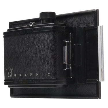 Graflex 23 Graphic roll film holder front three quarter view with darkslide