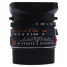 Leica Summicron-M 35mm f2 ASPH lens side view with mounted hood, aperture and focus scales