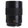 Leica APO-Summicron-SL 35mm f2 lens standing upright, front barrel with focus ring and orange 35 marking