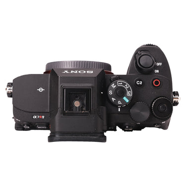 Sony A7R V top plate showing mode dial, hot shoe, and controls