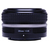 Nikon Z 28mm f2.8 SE lens side view showing knurled barrel and silver focus ring
