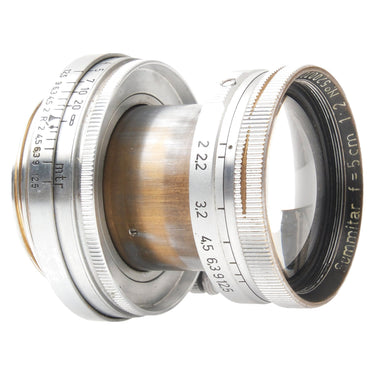Leica 5cm f2 Summitar angled view showing focus and aperture scales and brassed barrel
