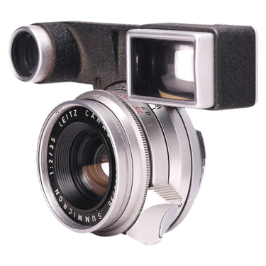 Leica Summicron 35mm lens and goggles, angled view showing focus tab