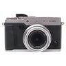 Fujifilm X30 silver front view with retracted Fujinon zoom lens