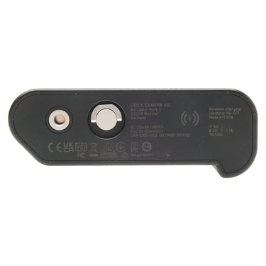 Leica HG-DC1 handgrip bottom plate with engraved Leica Camera AG markings and wireless charging symbol