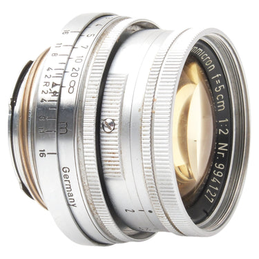Leica 5cm f2 Summicron angled view showing focus and aperture rings and distance scale